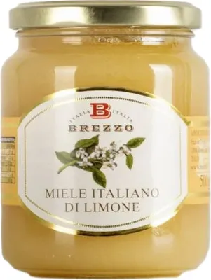 A jar of honey with a label.