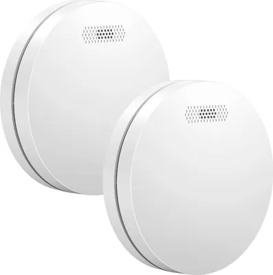 Two white smoke detectors are shown against a white background.