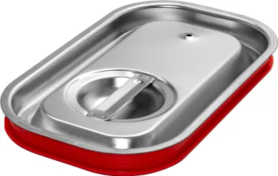 A rectangular stainless steel food pan with a red silicone seal and a raised, hinged lid with a circular opening and a small vent hole.