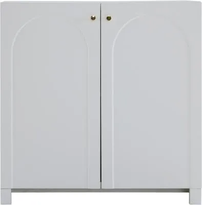 A front view of a white cabinet with two arched doors and gold knobs.