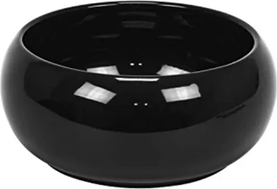 A black ceramic bowl on a white background.