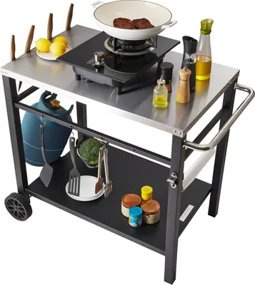 A stainless steel kitchen cart with cooking equipment and ingredients.