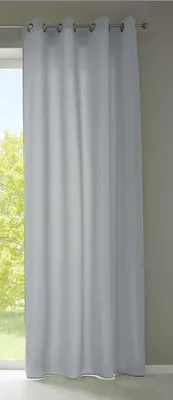 A light gray curtain hanging in front of a window.