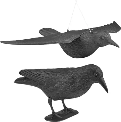 Two black bird decoys, one in flight and one perched, against a white background.