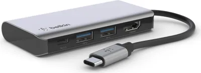 A silver and black Belkin USB-C multiport adapter with a connected USB-C cable is shown on a white background.