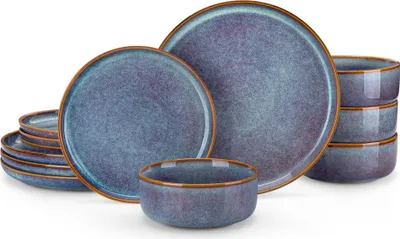 A set of blue and purple ceramic plates and bowls with brown rims, arranged on a white background.