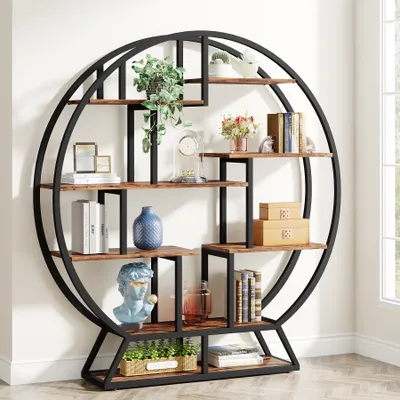 A round, industrial-style bookshelf with multiple shelves displaying various decorative items and books.