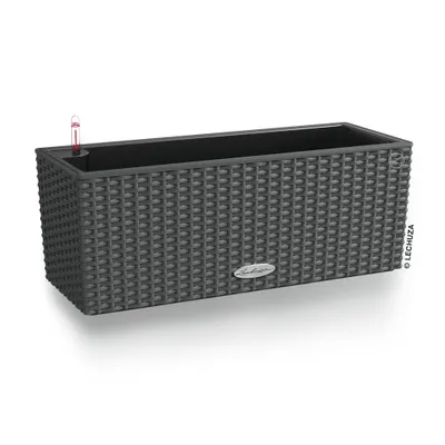 A dark gray rectangular planter with a woven texture, shown from a slightly elevated side angle on a white background. A small red and clear water level indicator is visible in the top left corner.