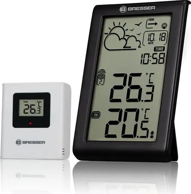 A weather station with a separate sensor unit is displayed against a white background.