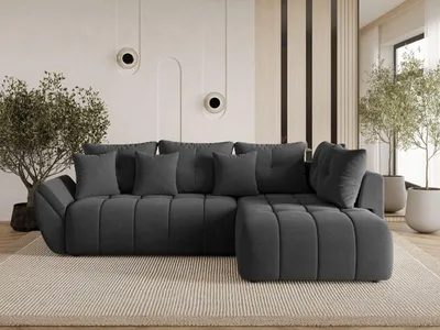 A modern living room with a dark gray sectional sofa.