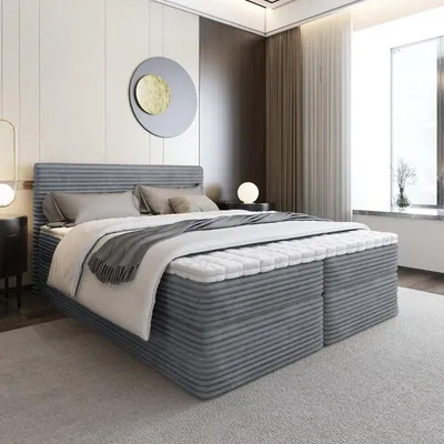 A modern bedroom with a large bed.