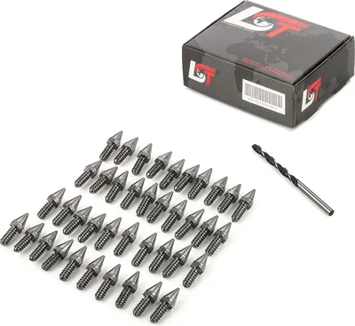 A collection of metal spikes and a drill bit are laid out on a white background, with a product box in the upper right corner.