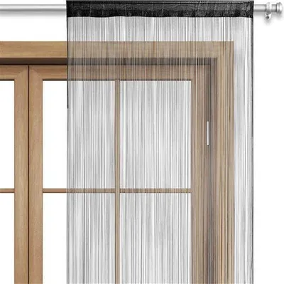 A string curtain hangs in front of a wooden window frame.