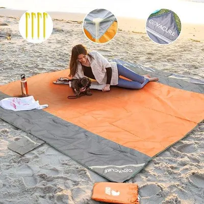 Produktbild von Unyqoos® Strand- & Picknickdecke 210 x 200 cm, wasserdicht & sanddicht, ultraleicht Parachutenylon, kompakt, inkl. 4 Heringe + Karabiner, Orange