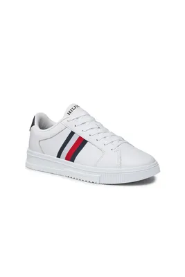 A white Tommy Hilfiger sneaker with red and blue stripes on a white background.