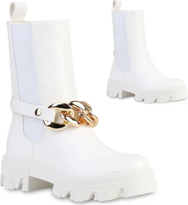 Two white platform boots with gold chain detail are shown against a white background.