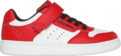 A side view of a red and white sneaker.