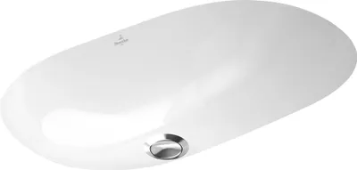 A white ceramic sink with a chrome drain.