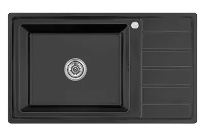 A top-down view of a black kitchen sink with a silver drain.