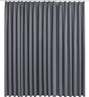 A full-frame shot of a gray curtain hanging from a rod.