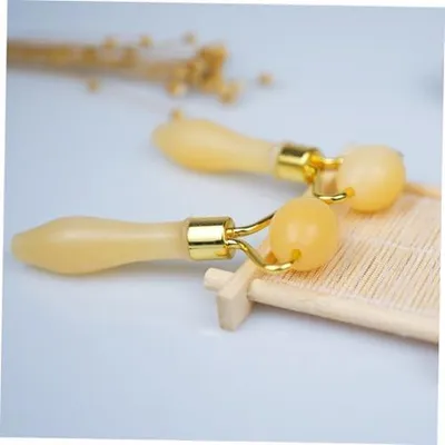 Image de Rouleau de jade jaune pour massage des yeux, idéal pour les soins de la peau, la relaxation et l'atténuation de la fatigue au quotidien