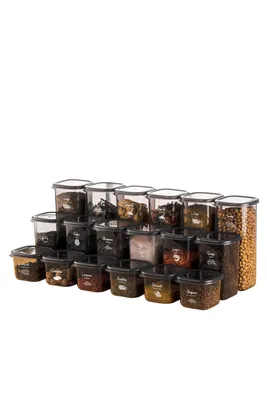 A collection of clear plastic food storage containers filled with various dry goods, arranged in rows on a white background.