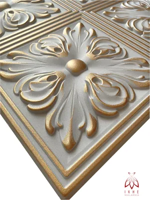 A close-up, angled view of a decorative 3D wall panel with a floral motif, highlighted with gold accents.