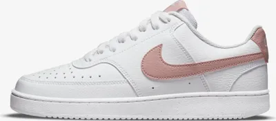A single white Nike sneaker with pink accents is shown against a white background.