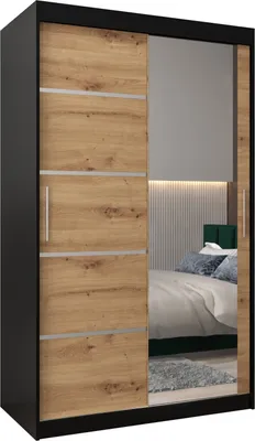 A wardrobe with mirrored doors reflecting a bedroom interior.