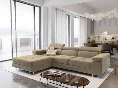 A modern living room with a large sectional sofa and a coffee table.