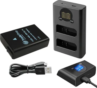 A set of camera accessories including a battery, a dual battery charger, and a USB cable, arranged on a white background.