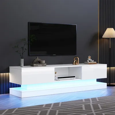 A modern white TV stand with LED lighting is shown in a living room setting.