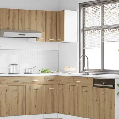 A modern kitchen corner with wooden cabinets and a sink.