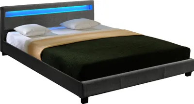 A modern bed with a grey fabric frame and a blue LED light strip on the headboard.
