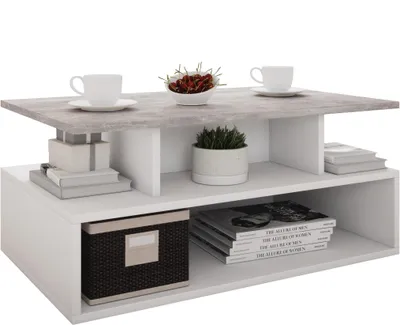 A modern coffee table with two shelves, decorated with cups, a plant, books, and a storage box.
