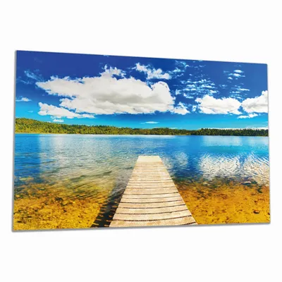 Produktbild von Wallario Herdabdeckplatte aus Glas, Größe 80 x 52 cm 1-teilig, Motiv Klarer See mit Steg - Blauer Himmel
