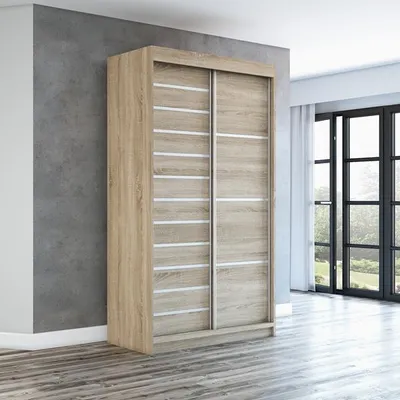 A modern sliding door wardrobe in a room with a concrete wall and wooden floor.