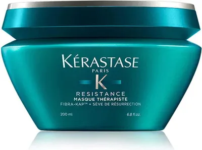 A teal colored hair mask product in a jar with a silver lid.