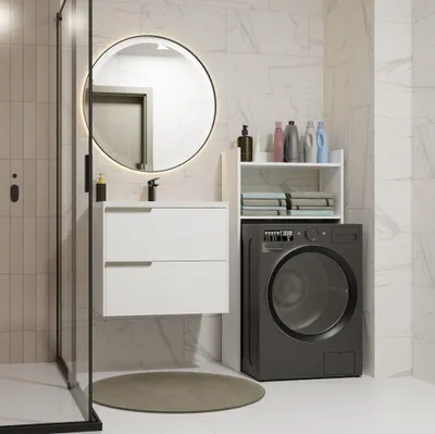 A modern bathroom with a washing machine, vanity, and shower.
