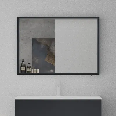 A bathroom vanity with a mirror above it, featuring some decorative elements and toiletries on a shelf.