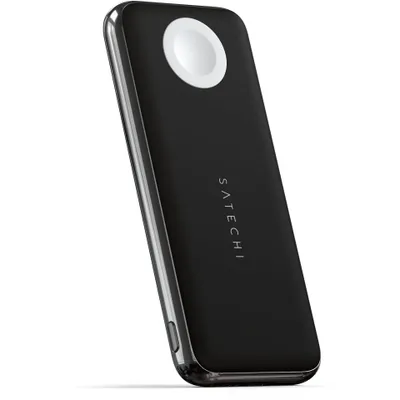 A black Satechi Quatro Wireless Power Bank with a white charging pad on top, shown at an angle against a white background.