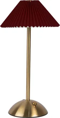 A red pleated table lamp with a gold stand and base, shown against a white background.