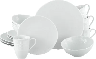 A collection of white porcelain dishes and cups arranged on a white background.