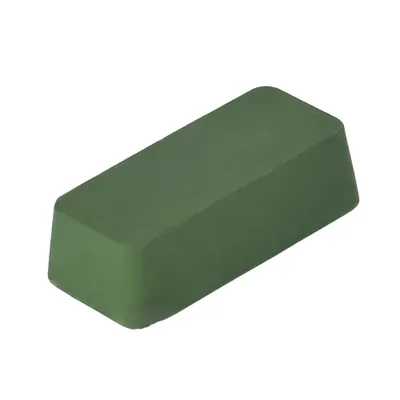 A green polishing block on a white background.