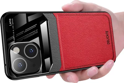 A hand holding an iPhone 14 Plus case.