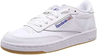 A white Reebok Club C 85 sneaker with a gum sole is shown against a white background.