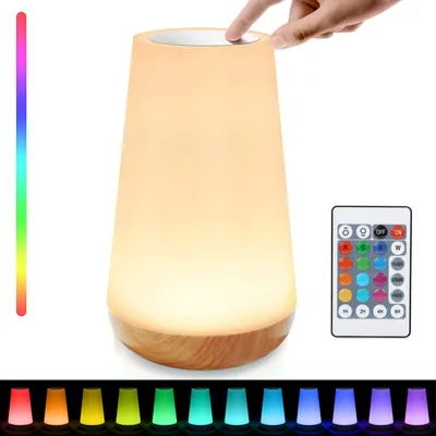 A touch-sensitive LED lamp with a wooden base, shown with a remote control and a spectrum of colors.