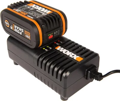 A black WORX battery charger with a black and orange WORX 20V lithium-ion battery attached, shown on a white background.