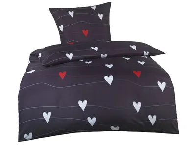 A bedding set with a heart pattern on a white background.