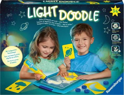 Two children are playing with a light doodle toy in a dimly lit room.